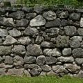 What is the difference between a boundary wall and a party fence wall?